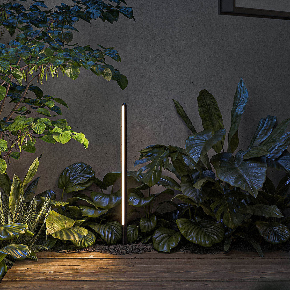 Längliche stabförmige außen Erdspießleuchte schwarz im Beet im Garten