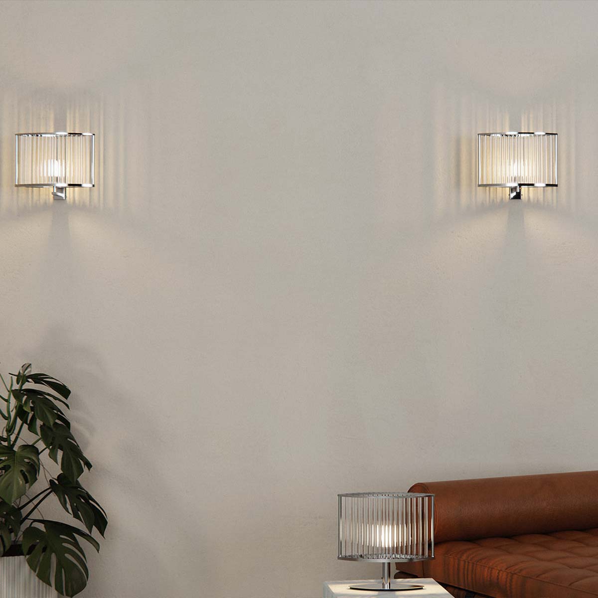Licht im Raum Stilio Zwei Wandleuchten und eine Tischleuchte mit geschwungenem Glasschirm im Wohnzimmer hängend