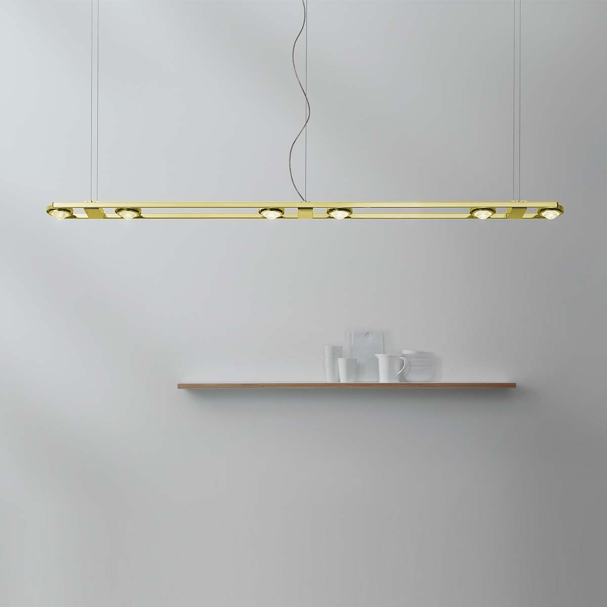 Moderne und längliche Pendelleuchte mit sechs Linsen in der Farbe messing natur